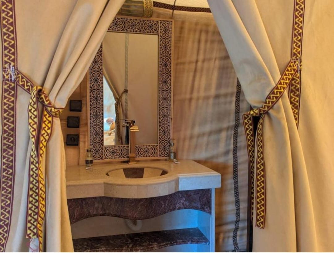 Spacious quadruple tent interior at the Grand Dune desert camp in Merzouga